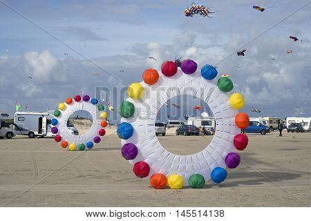LAKOLK DENMARK - SEPTEMBER 3 2016: Colorful kites on the big beach on Lakolk Romo. International Kite Festival for the 27th time. September 3 2016.