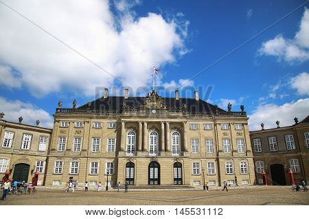 Copenhagen Denmark - August 15 2016: Amalienborg Square with tourist it's home of the Danish Royal family in Copenhagen Denmark
