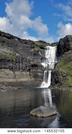 Reflection of Oferufoss waterfall Eldgja gorge Iceland