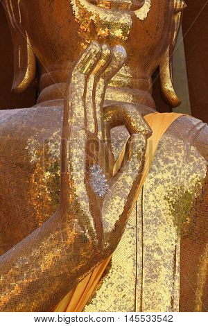 Gold Buddha statue (Luang por shin pa tan porn) in Thailand temple at Kanchanaburi temple (Wat Tham Sua).