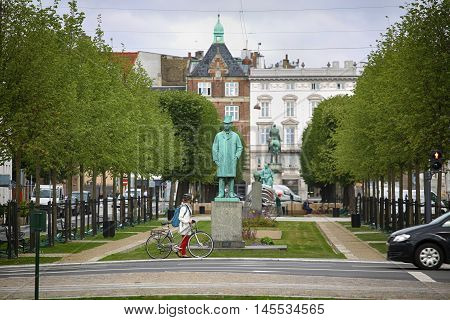 Copenhagen Denmark - August 15 2016: View on park and Statue of Carl Frederik Tietgen in Toldbodgade street which is located near Nyhavn harbor in Copenhagen Denmark