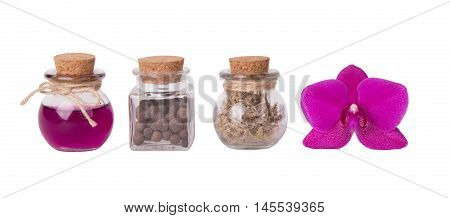 Pink orchid and small bottles. Spa concept. Isolated on white.