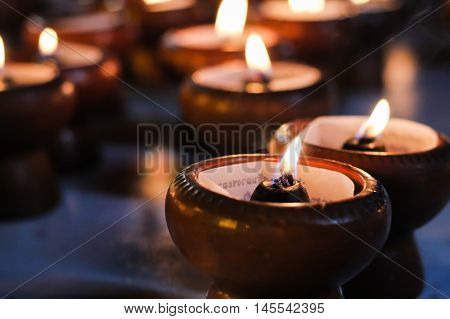 A Blur light  candles in the dark background.