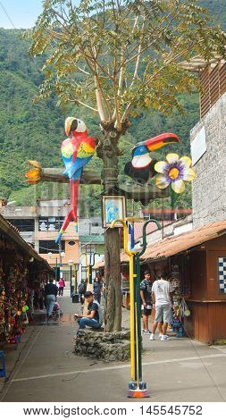 Banos de Agua Santa, Tungurahua / Ecuador - September 2 2016: Bird sculptures in the Pasaje Artesanal in the downtown of the city. Banos is located on the northern foothills of the Tungurahua volcano