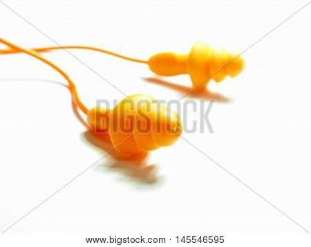 orange isolated pair earplug on white background