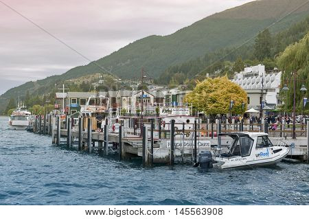 Queenstown New Zealand - March 2016: Boat piers at Queenstown lakefront by Lake Wakatipu New Zealand