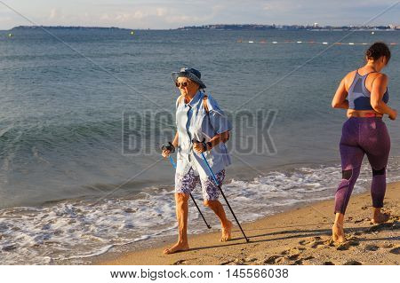 GRODNO BELARUS - SEP 02: People of different generations involved in the sport on the coast in Nesebar Bulgaria at September 02 2016