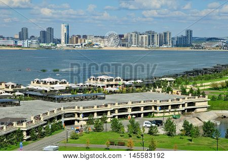 Kazan, Tatarstan, Russia - September 4, 2016. A view of the Kremlin embankment of the river Kazanka. Right and left bank of the Kazanka River. New Savinovskij district.