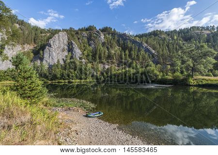 Republic of Bashkortostan Russia. Rubber boats on the shore of a mountain river.
