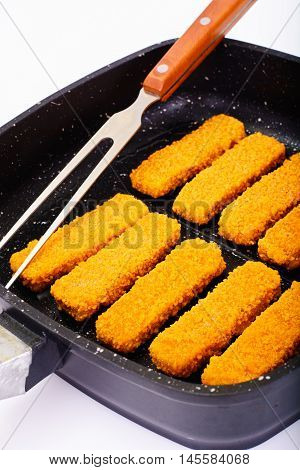 Fish sticks breaded Studio Photo on Pan