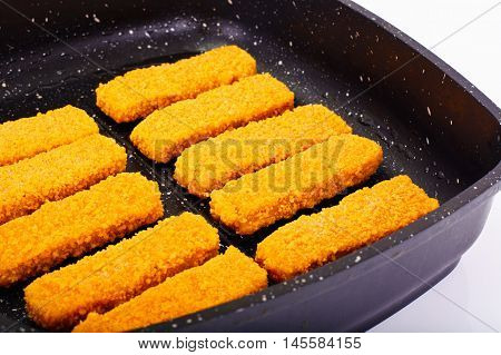 Fish sticks breaded Studio Photo on Pan
