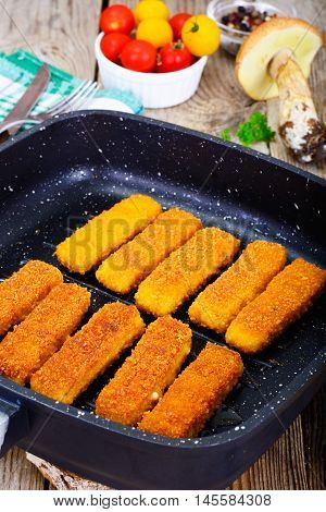 Fish sticks breaded Studio Photo on Pan