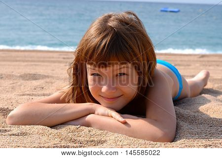 Sunbathing and swimming a pleasure for a child