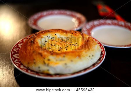 Uzbek bread on a plate on the table