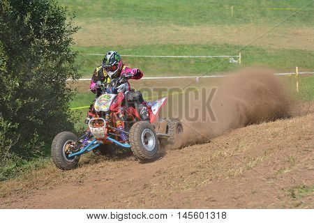 Unidentified Racer Rides A Quad Motorbike.