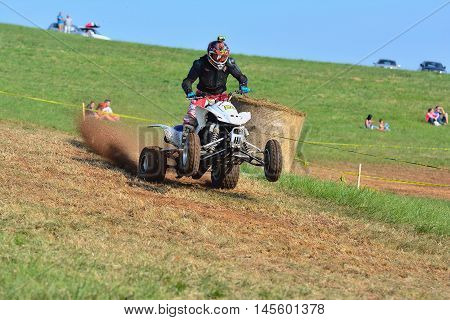 Unidentified Racer Rides A Quad Motorbike.