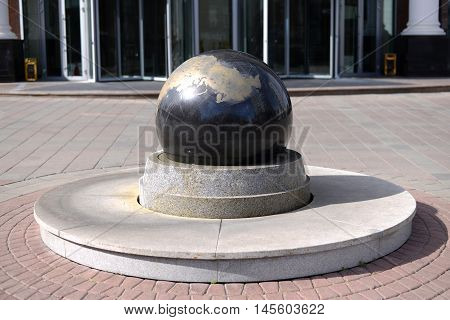 Granite ball mounted on a stand in the town square