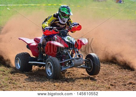 Unidentified Racer Rides A Quad Motorbike.