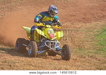 Unidentified Racer Rides A Quad Motorbike.