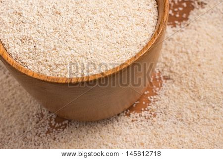 Farinha de Mandioca. Manioc. Cassava flour over a wooden table