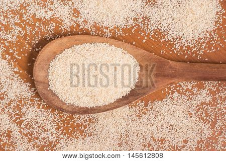 Farinha de Mandioca. Manioc. Cassava flour over a wooden table