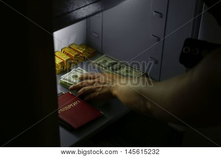 Thieves stealing money from safe
