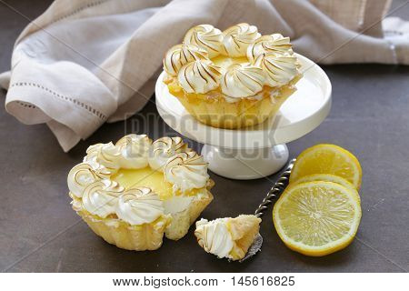 tartlet with lemon cream and meringue on a table