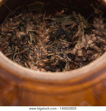 medicinal herbs has been decocted with enamel pot close up