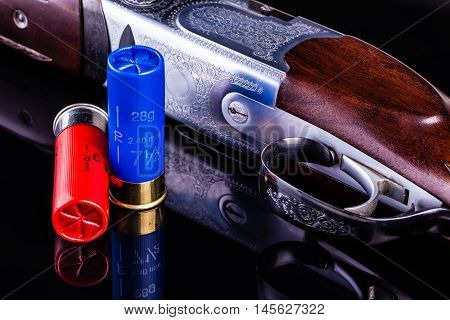 Shotgun On Black With Shells