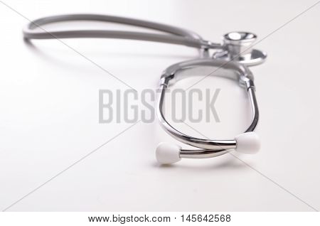 Grey stethscope isolated on white background with lighting