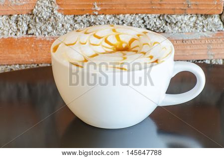 Coffee cup on wooden table ,soft focus
