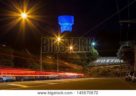 Foxton Icon the old water tower lights up with the color of blue.