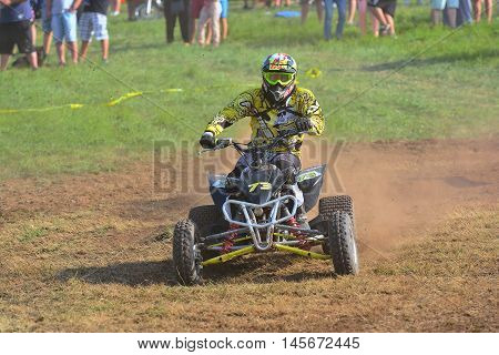 Unidentified Racer Rides A Quad Motorbike.