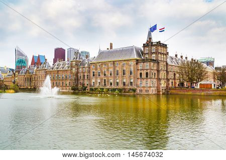 Famous parliament and court building Binnenhof and lake in Hague, Holland
