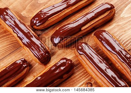 Eclairs On Wooden Table