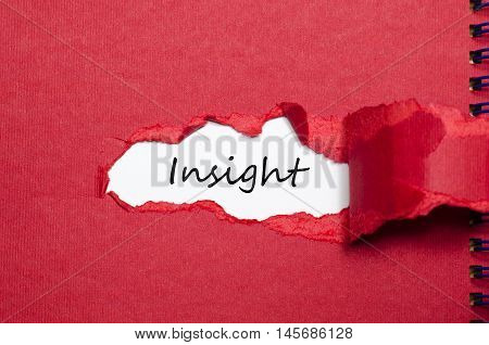 The word insight appearing behind torn paper