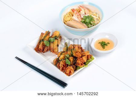 Japanese noodle "ramen" topped steamed streaky pork and shrimp in pork's bone soup served with god bar and gold bag food on white background.