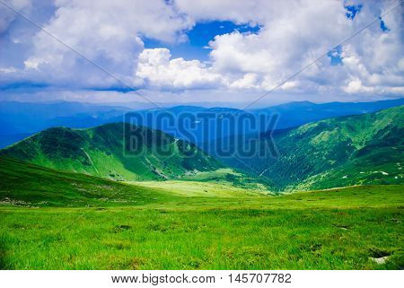 Beautiful blue sky and glade high up in Carpathian mountains