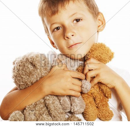 little cute boy with many teddy bears hugging isolated on white background close up