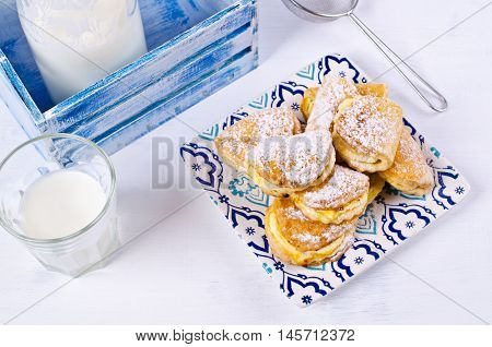 Homemade buns stuffed with cottage cheese on a wooden background. Selective focus.