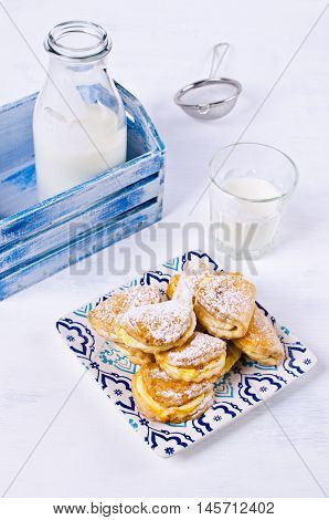 Homemade buns stuffed with cottage cheese on a wooden background. Selective focus.