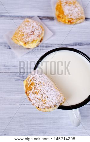 Homemade buns stuffed with cottage cheese on a wooden background. Selective focus.