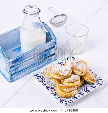Homemade buns stuffed with cottage cheese on a wooden background. Selective focus.
