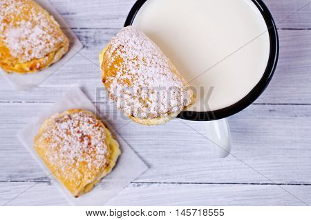 Homemade buns stuffed with cottage cheese on a wooden background. Selective focus.