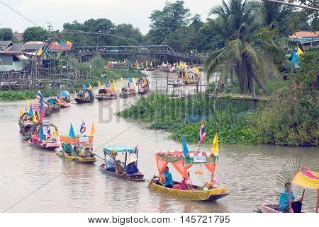 AYUTTHAYA, THAILAND - JULY 15, 2011 : Beautiful flower boats in floating parade, the unique annual Lad Chado candle floating festival of Buddhist lent on July 15, 2011 in Lad Chado canal, Ayutthaya Province, Middle  of  Thailand.