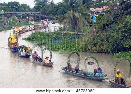 AYUTTHAYA, THAILAND - JULY 15, 2011 : Beautiful flower boats in floating parade, the unique annual Lad Chado candle floating festival of Buddhist lent on July 15, 2011 in Lad Chado canal, Ayutthaya Province, Middle  of  Thailand.