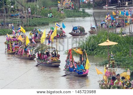 AYUTTHAYA, THAILAND - JULY 15, 2011 : Beautiful flower boats in floating parade, the unique annual Lad Chado candle floating festival of Buddhist lent on July 15, 2011 in Lad Chado canal, Ayutthaya Province, Middle  of  Thailand.