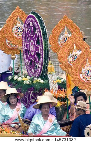 AYUTTHAYA, THAILAND - JULY 15, 2011 : Beautiful flower boats in floating parade, the unique annual Lad Chado candle floating festival of Buddhist lent on July 15, 2011 in Lad Chado canal, Ayutthaya Province, Middle  of  Thailand.