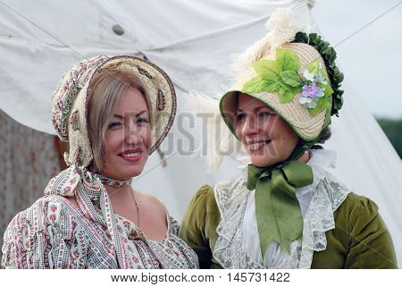 BORODINO MOSCOW REGION - SEPTEMBER 04 2016: Reenactors women portrait at Borodino battle historical reenactment in Russia. Color photo.