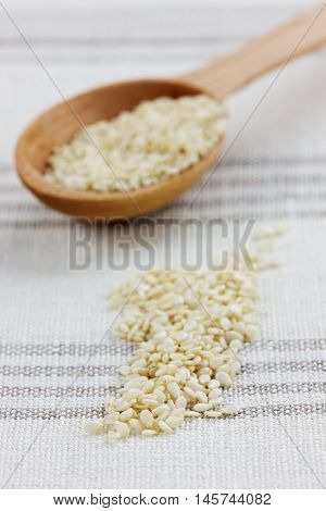 Sesame seeds on a linen napkin. Rustic style.